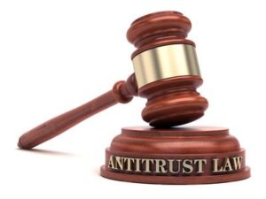 Blog Antitrust laws: The image shows a gavel with the words "antitrust law" written on the sound block