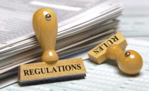 Blog Image of papers with two stamps "bank regulations" and "rules"