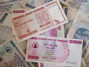 Blog Causes of hyperinflation: Picture shows some 50 billion dollar Zimbabwean bank notes