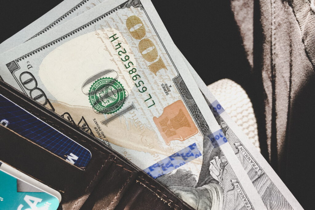 Governments creating money out of thin air is counterfeiting? Creating money out of thin air: Picture shows a sheaf of USD $100 bills