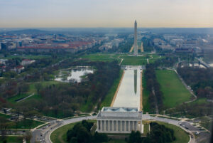 Blog Institutionalism: The image is an aerial view of the Washington monument and the reflecting pond, showing the back of the Lincoln memorial in the foreground