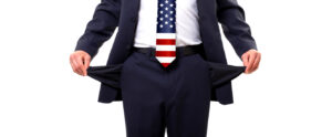 Blog US government broke? Image shows a man wearing a US flag tie with outturned pockets.