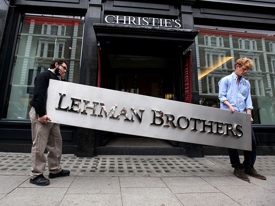 Angrynomics – The summary: Part 6 Angrynomics: Image of the Lehman Brothers sign being carried down the street