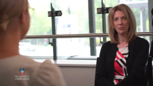 Blog Modern Monetary Theory: A picture of Stephanie Kelton being interviewed by an economics student at the University of Adelaide