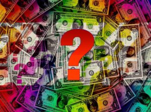 Blog The existence of money: Image shows a set of scattered US currency notes with a large question mark in the foreground.