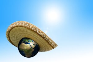 Blog The Green New Deal: Image shows the earth wearing a sombrero to protect itself from the heat of the sun