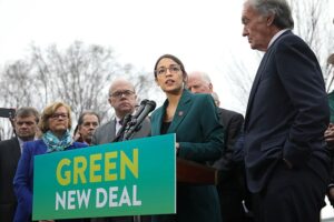 Blog The Green New Deal: A picture of Representative Alexandria Occasio-Cortez and Senator Ed Markey at a rally